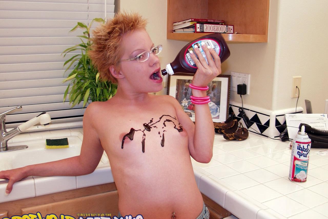 20P Naughty redhead Emily Davinci goes topless & indulges in a food play solo