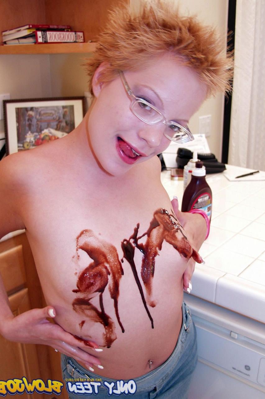 20P Naughty redhead Emily Davinci goes topless & indulges in a food play solo