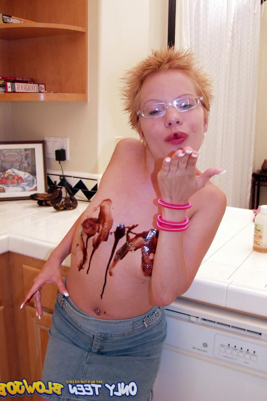 20P Naughty redhead Emily Davinci goes topless & indulges in a food play solo