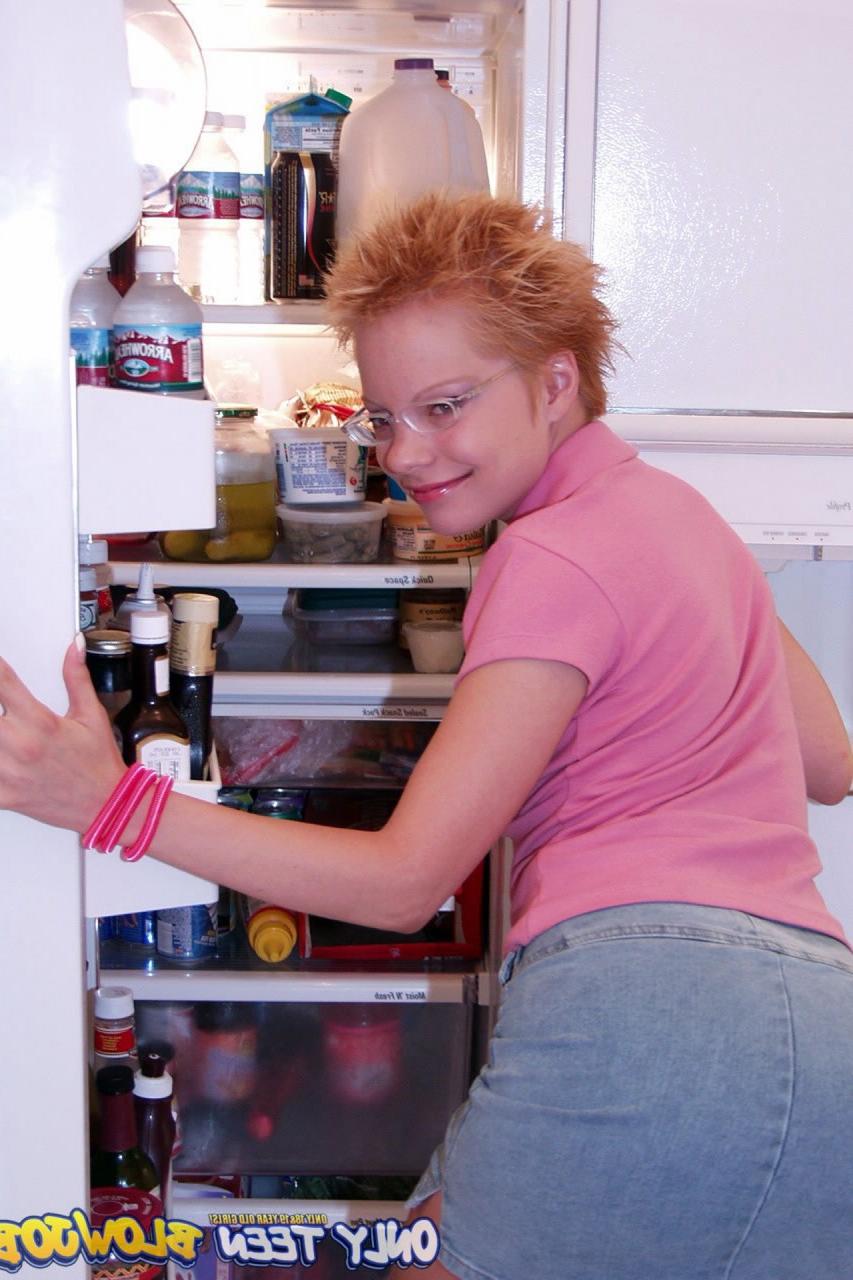 20P Naughty redhead Emily Davinci goes topless & indulges in a food play solo