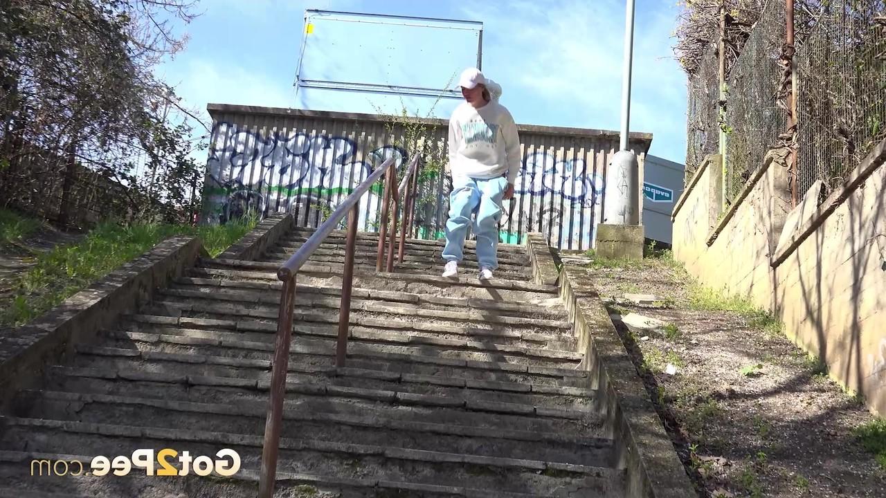 14P Caucasian chick Claudia Macc gets caught taking a piss on a flight of steps