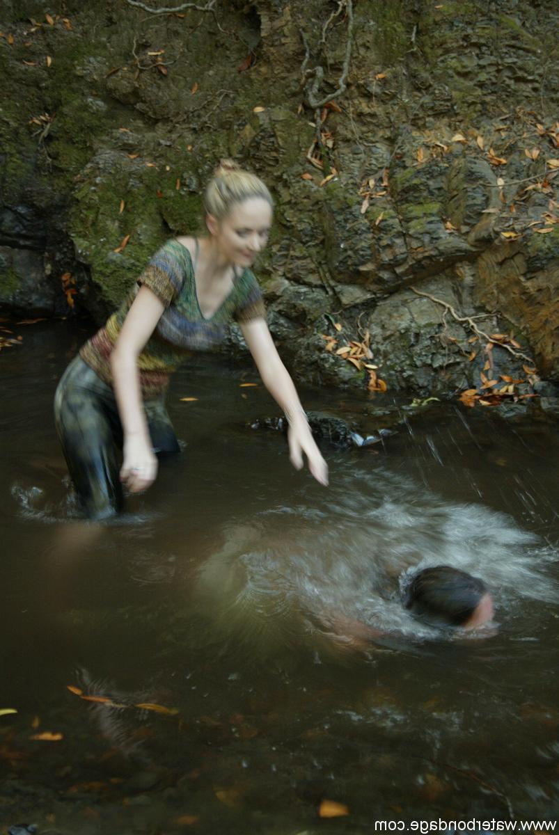 20P Busty virgin gets schooled by a blonde lezdom in outdoor water bondage action