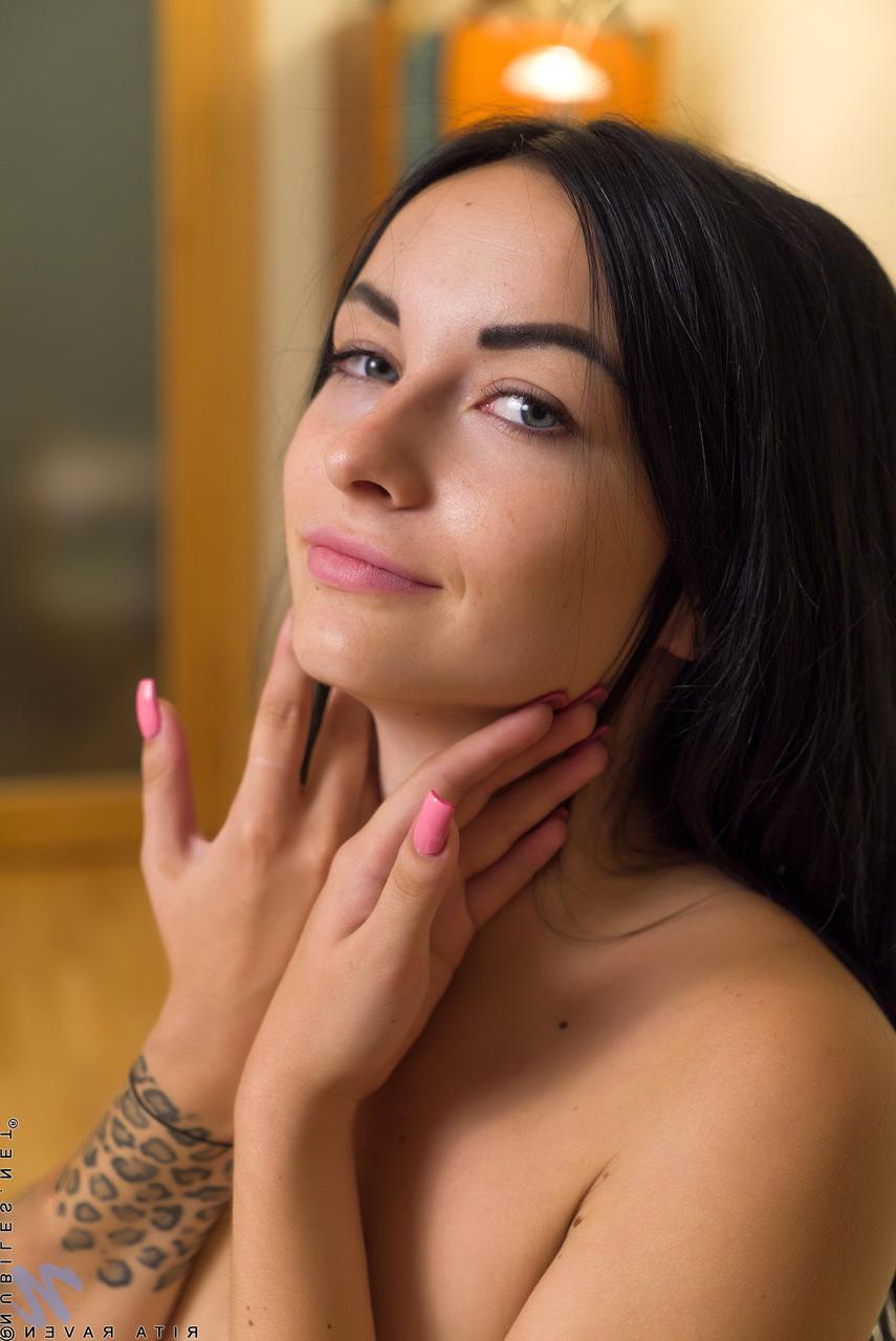 20P Petite Russian Rita Raven strips to her nylon stockings & rubs her meaty pussy