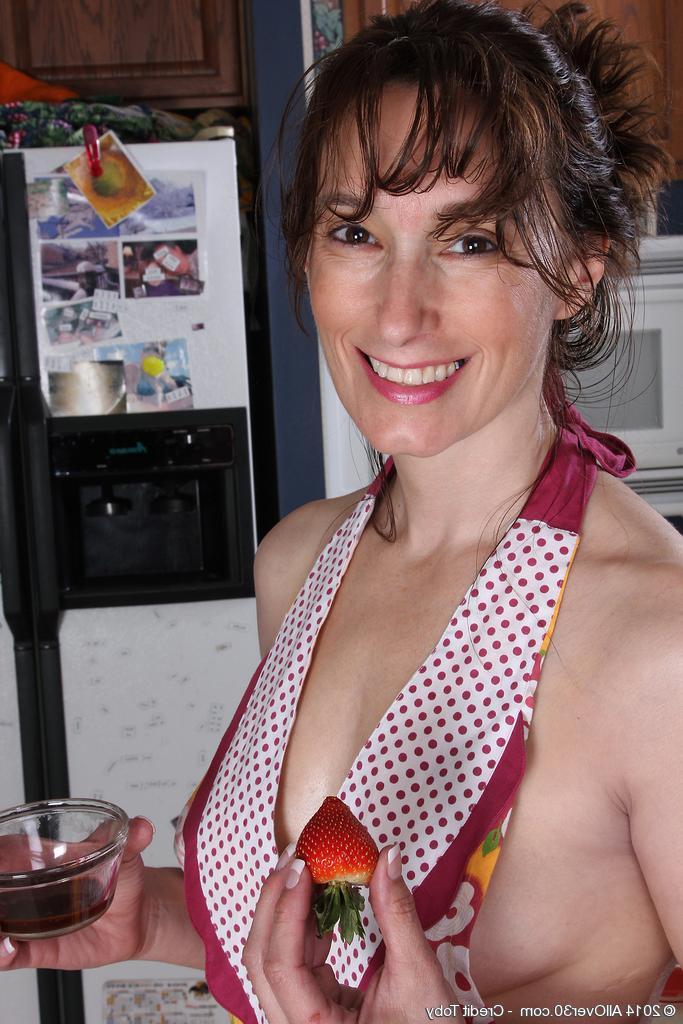 15P Middle-aged lady Celeste Carpenter takes off her apron to pose nude in kitchen