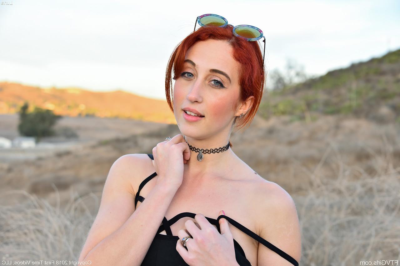 20P Redheaded Peruvian babe Luna unveils her tiny tits & ass while jogging outside
