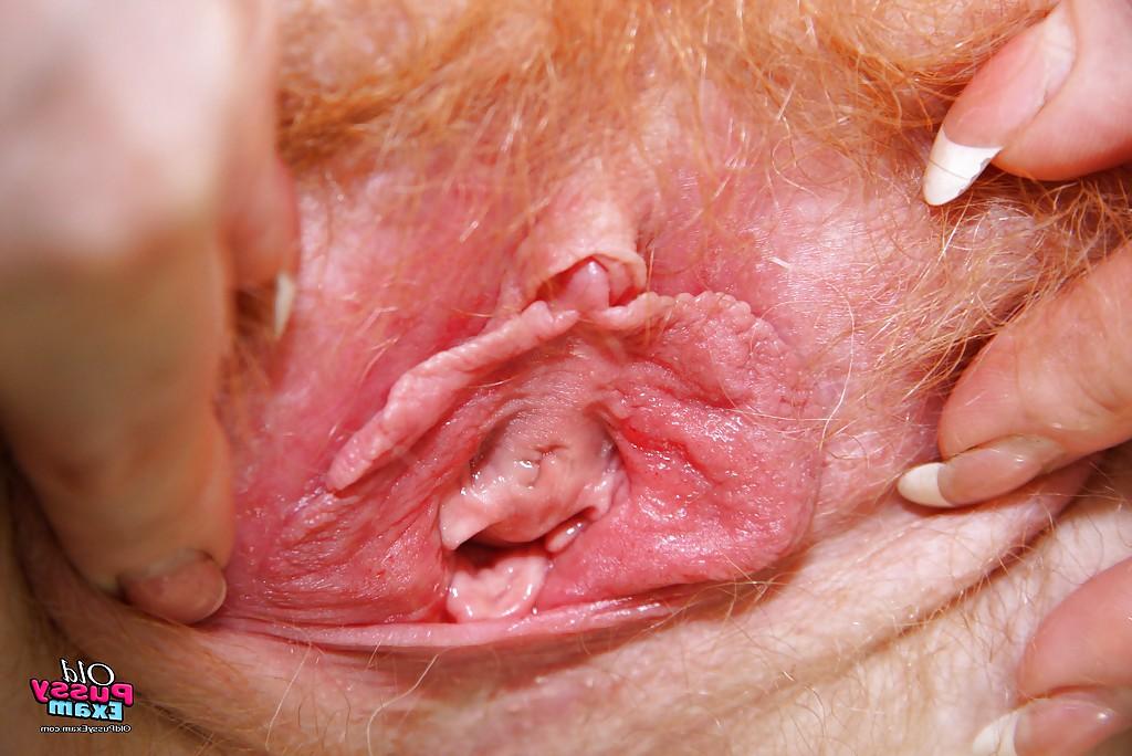 16P Filthy redhead mature nurse in glasses toying her hairy muff