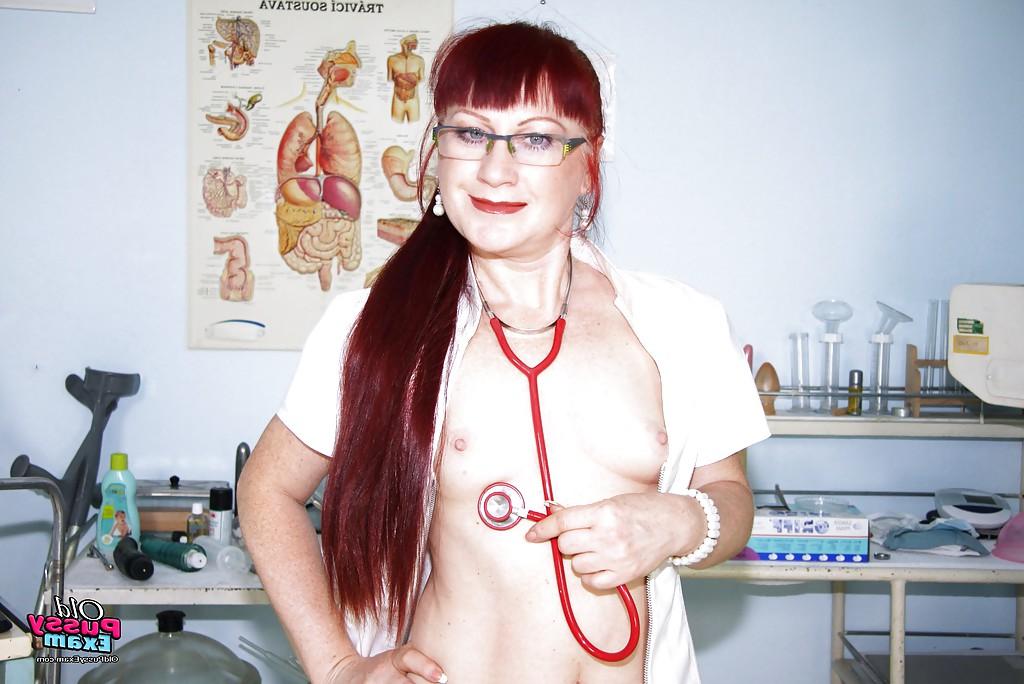 16P Filthy redhead mature nurse in glasses toying her hairy muff