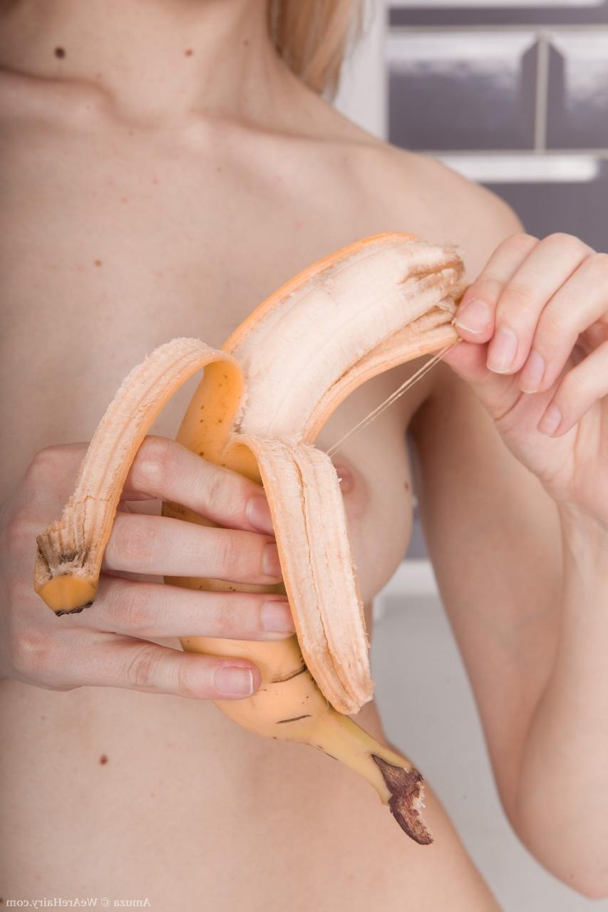 17P Slim alluring Amuza does kitchen striptease to toy hairy pussy with a banana