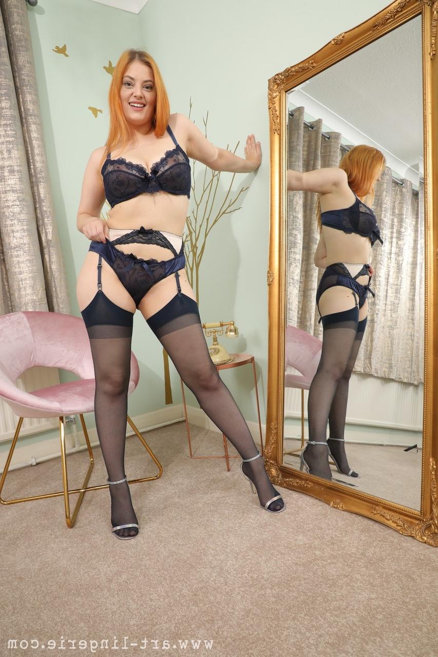 16P Natural redhead Lottii Rose unveils her big tits while wearing nylons