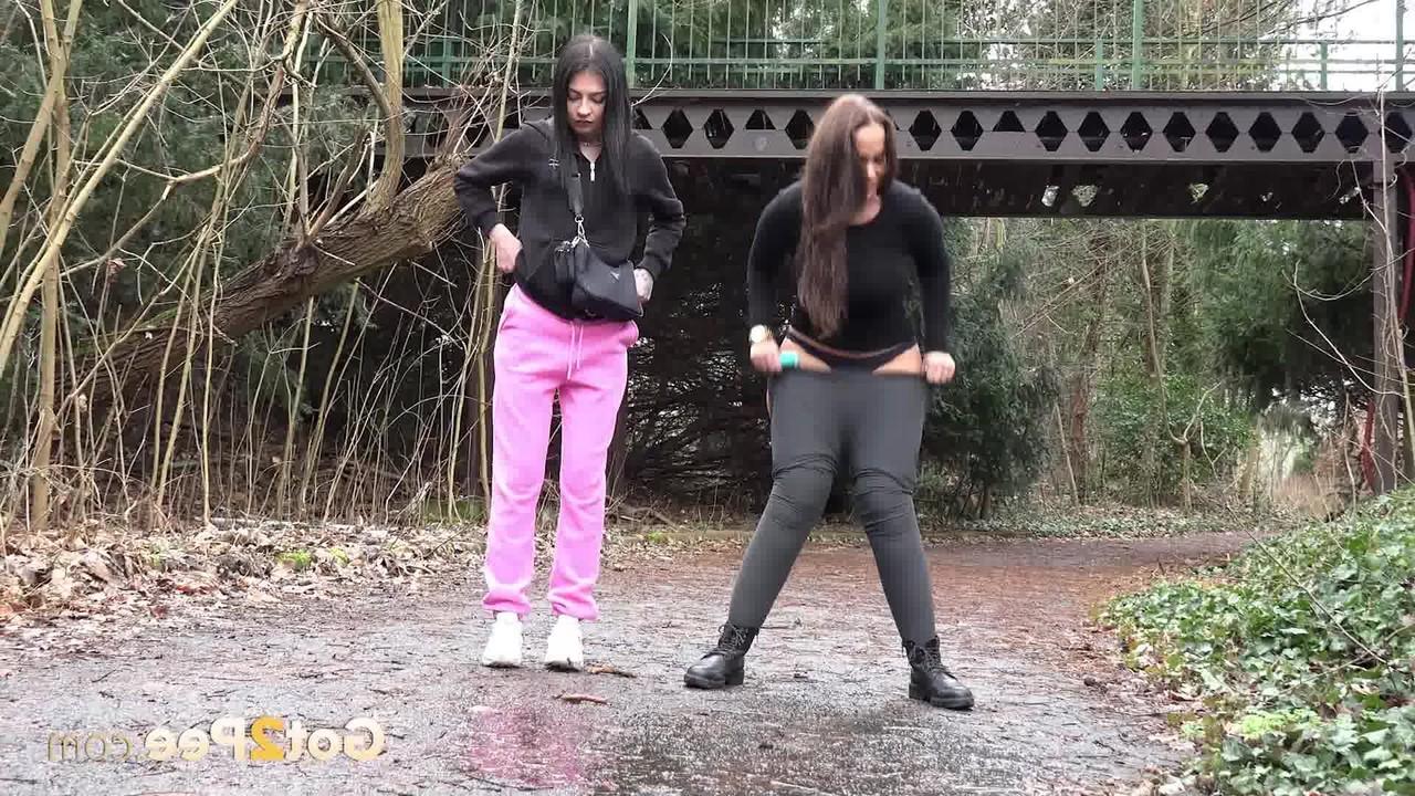 15P Selena and her girlfriend both squat to take a piss on a rural path