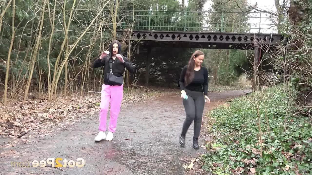 15P Selena and her girlfriend both squat to take a piss on a rural path