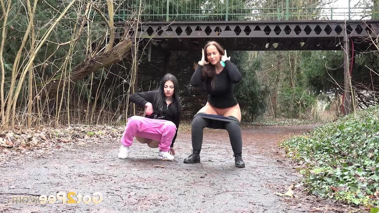 15P Selena and her girlfriend both squat to take a piss on a rural path