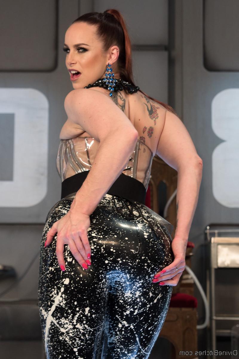 9P Busty mistress Bella Rossi poses in her latex outfit in front of her throne