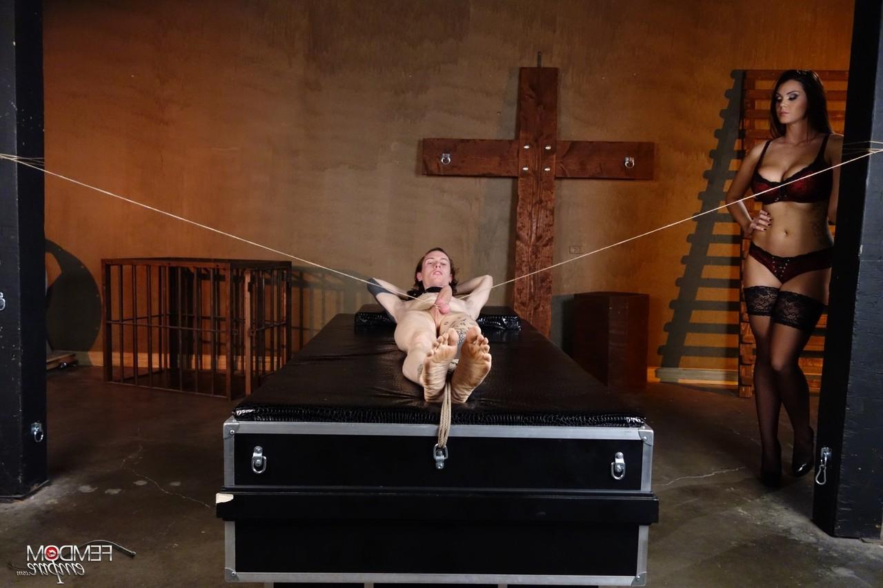 16P Mistress Alison Tyler jerks on a restrained man's penis in a dungeon