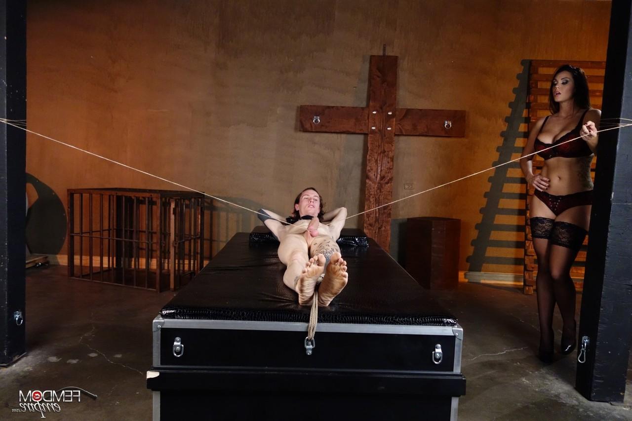 16P Mistress Alison Tyler jerks on a restrained man's penis in a dungeon