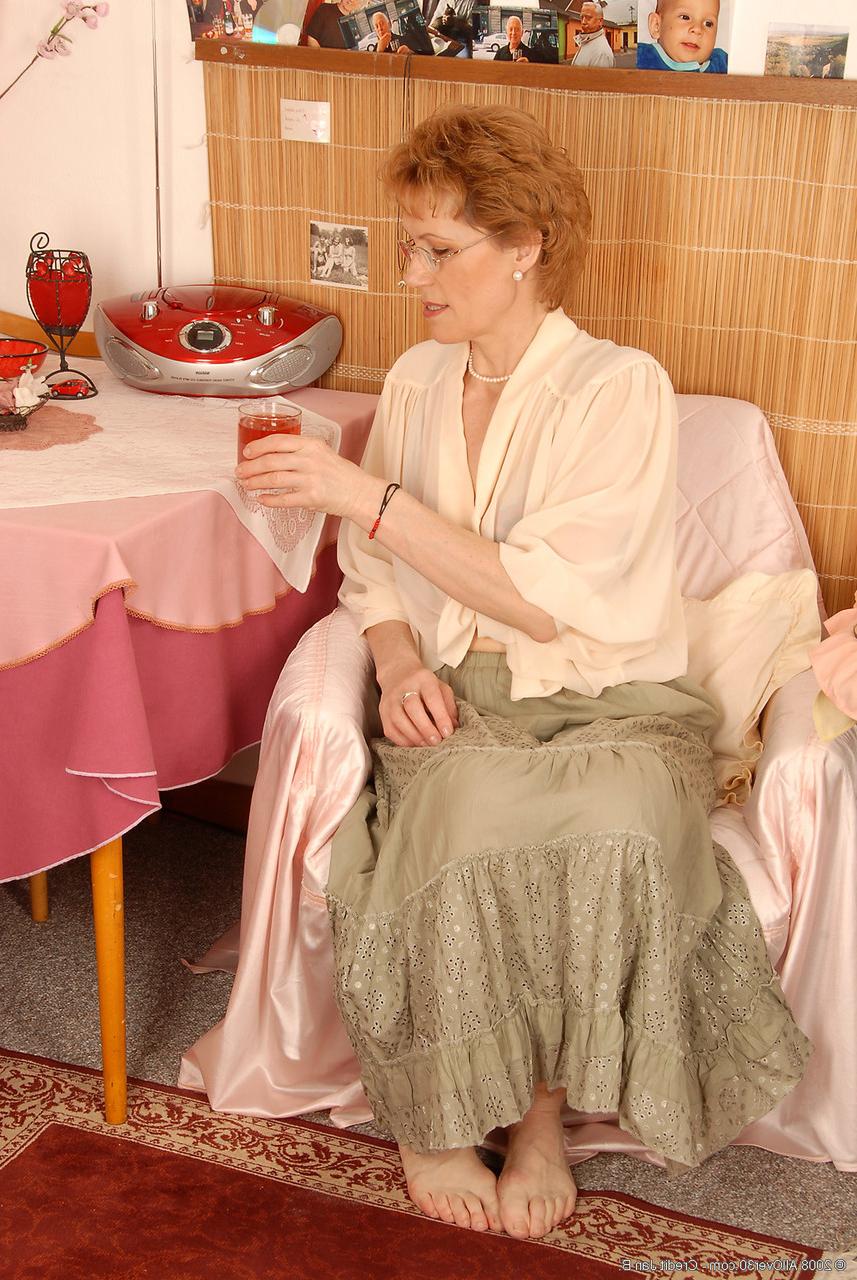 20P Voluptuous mature lady Georgina C undresses & touches her hairy cunt