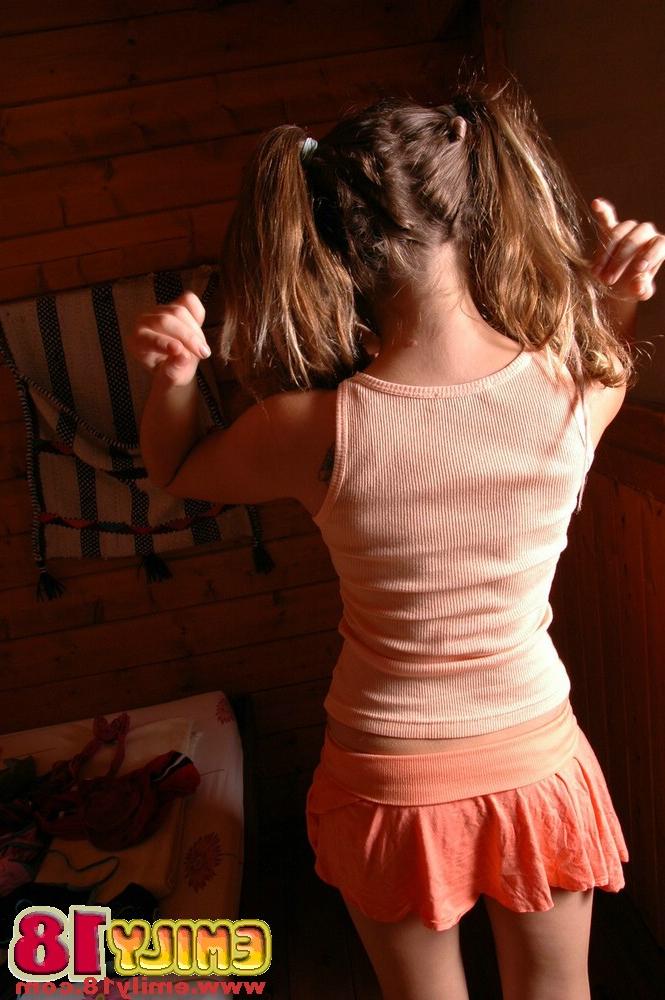 15P Adorable teen plays with her tiny boobs with her hair set into pigtails