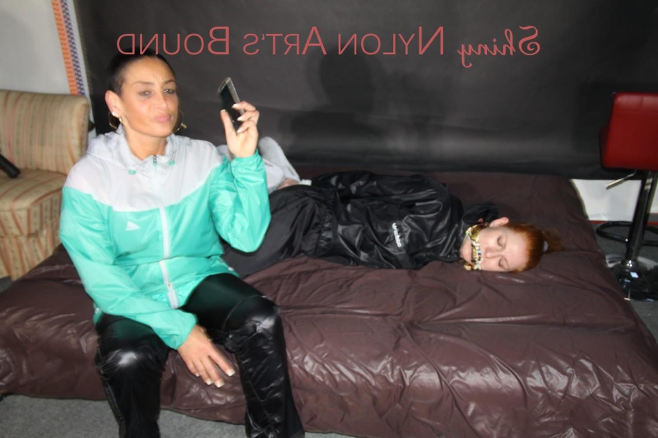 16P Natural redhead is left tied up and gagged by a fully clothed dyke
