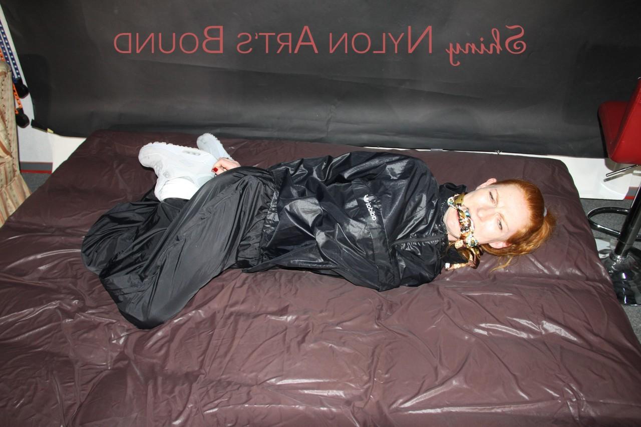 16P Natural redhead is left tied up and gagged by a fully clothed dyke