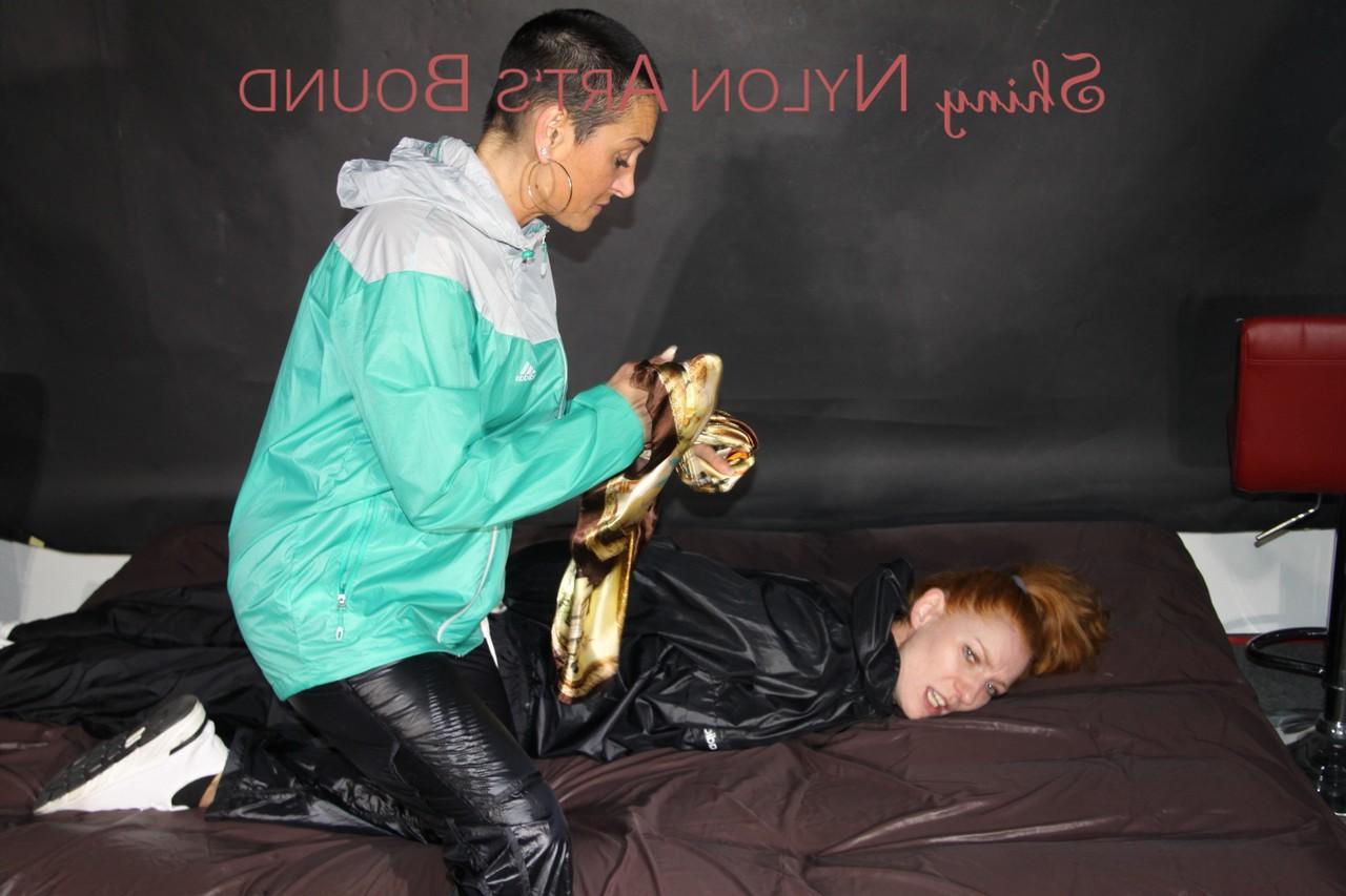 16P Natural redhead is left tied up and gagged by a fully clothed dyke