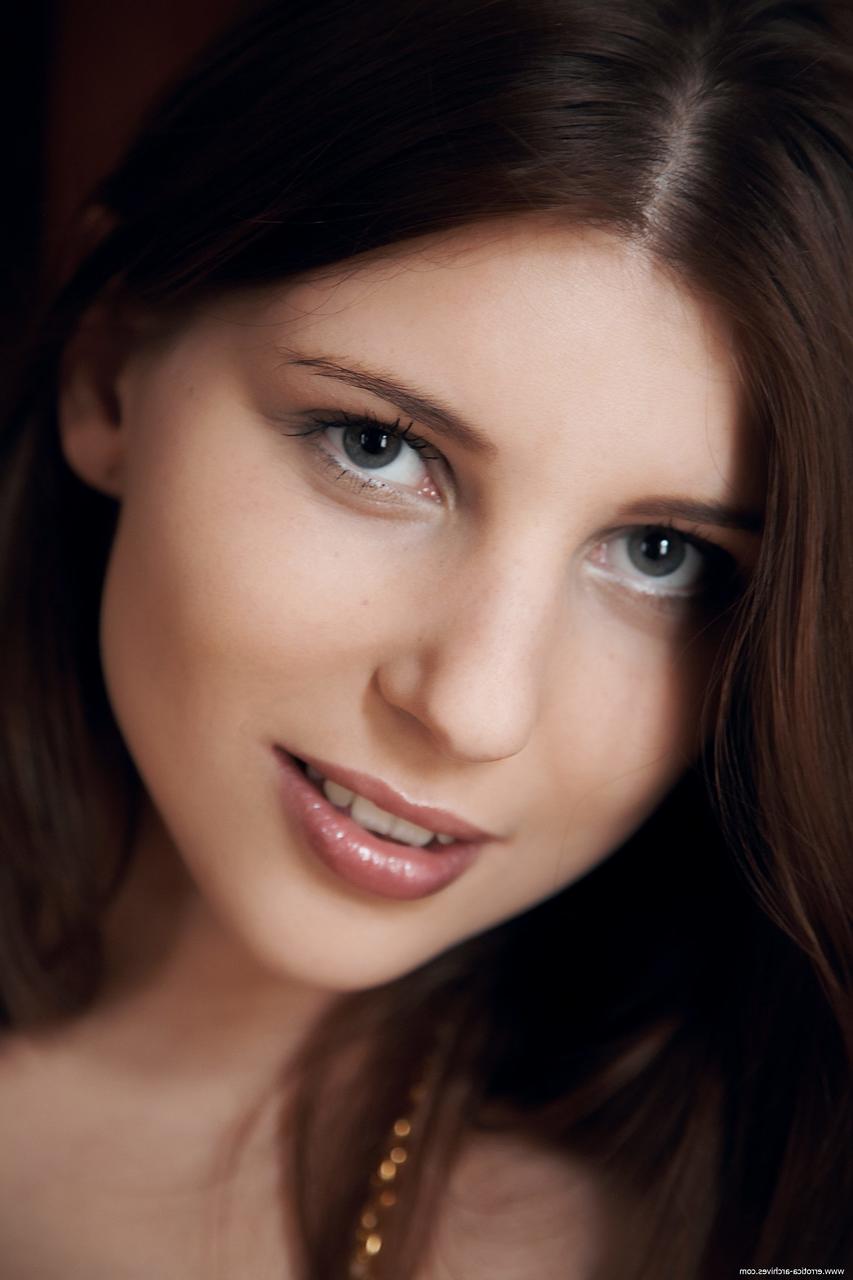 17P Barefoot white girl with shoulder length hair flaunts her full breasts