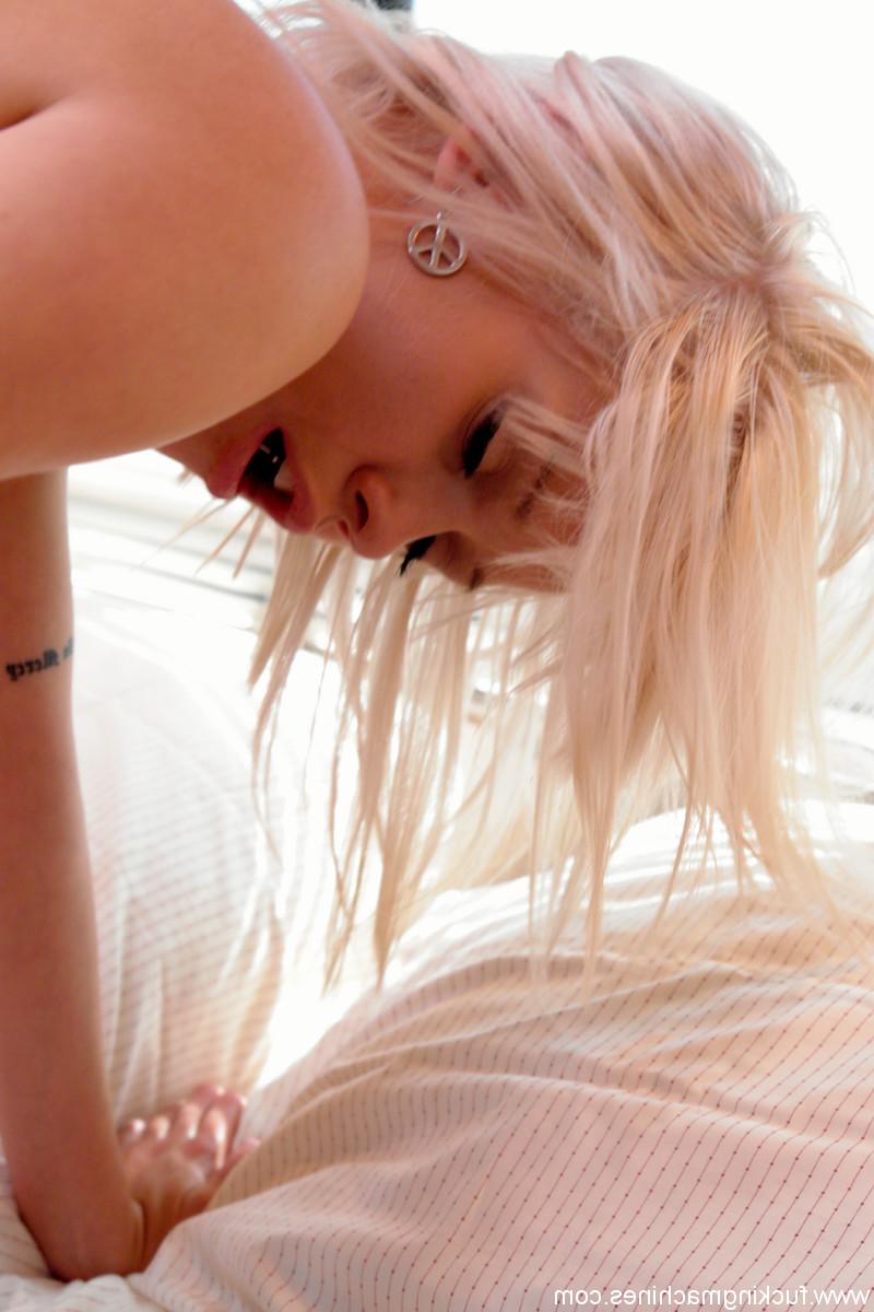 20P Blonde Kissy Kapri bends over a bed and gets both her holes toyed by a machine