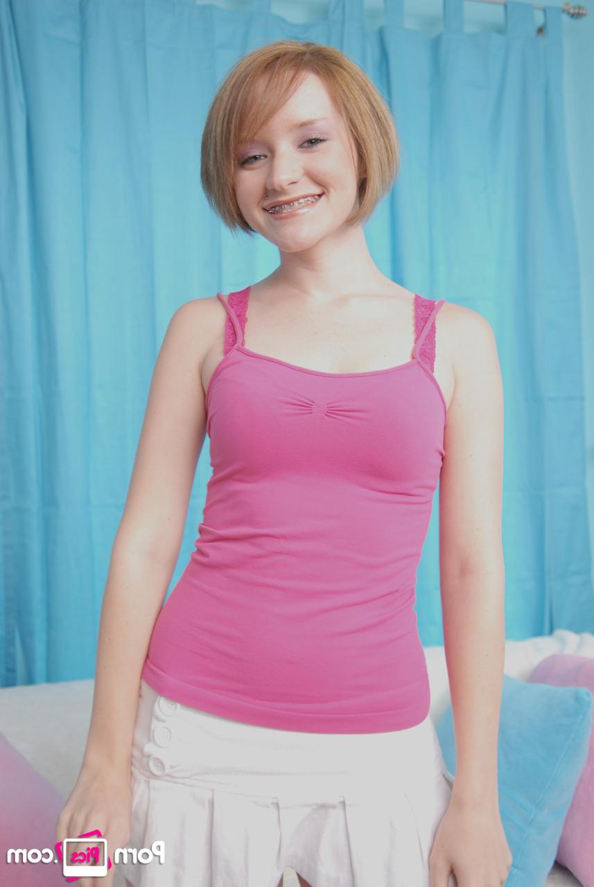 20P Petite cutie with small boobs Faith Daniels shows off her body while stripping