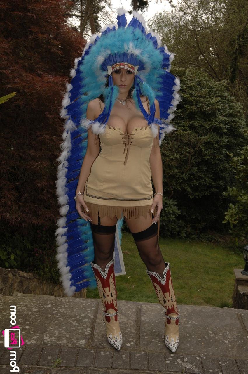 20P MILF Carmella Bing shows her big tits & bald cunt while teasing in a headdress