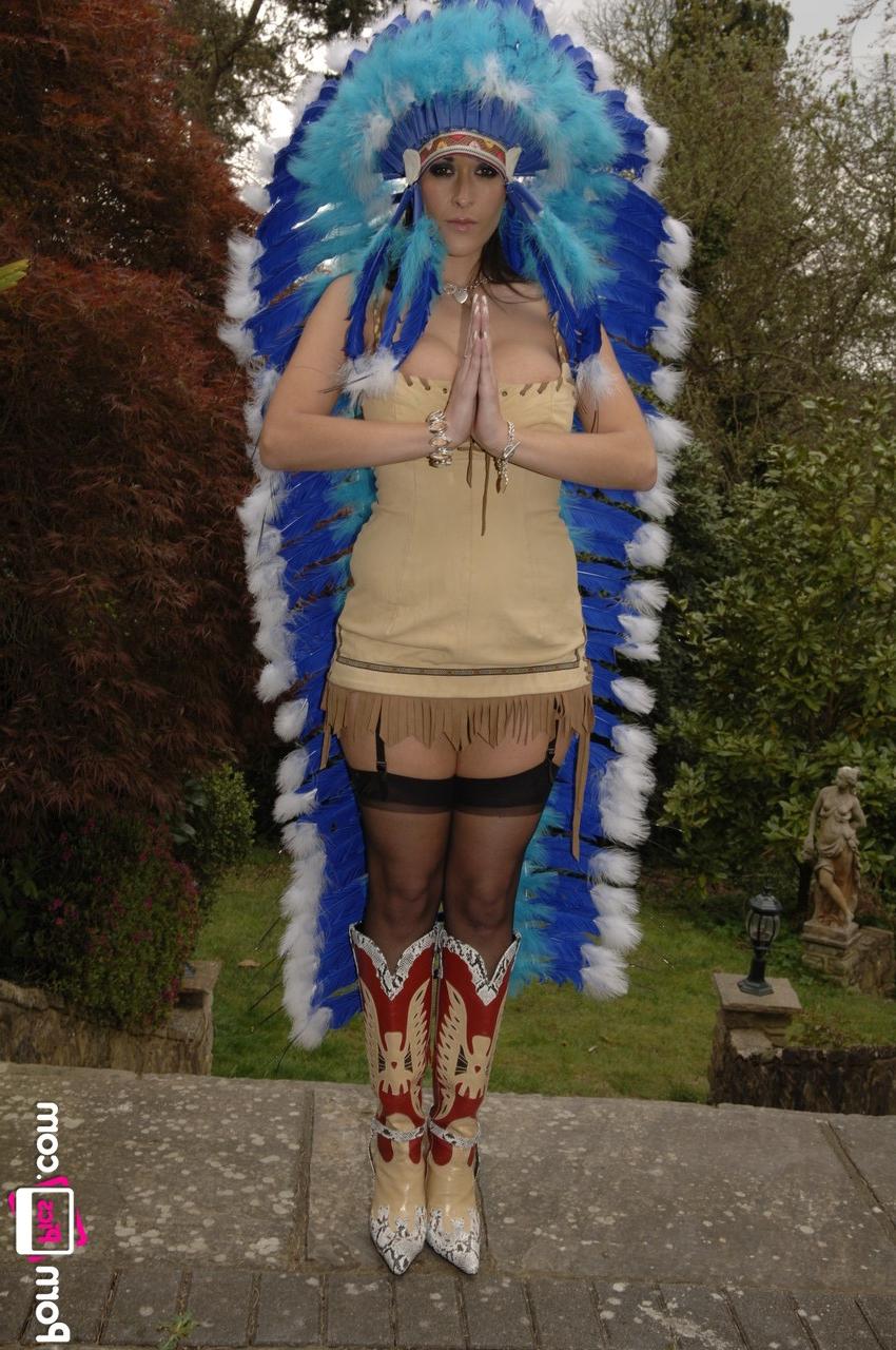 20P MILF Carmella Bing shows her big tits & bald cunt while teasing in a headdress