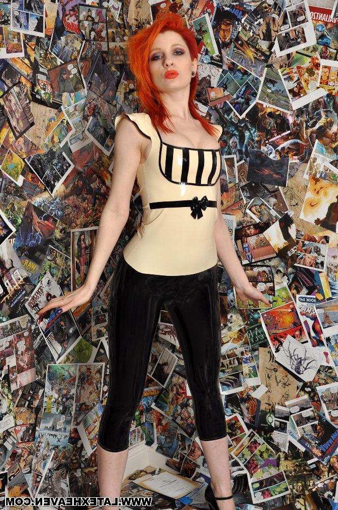 12P Pale redhead strikes provocative poses while wearing latex clothing