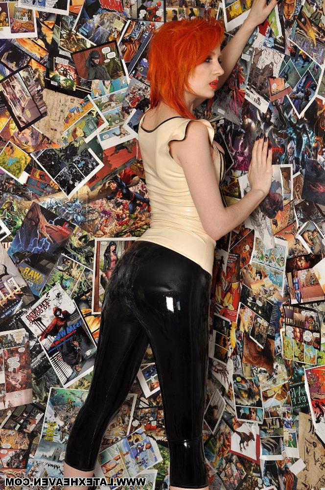 12P Pale redhead strikes provocative poses while wearing latex clothing