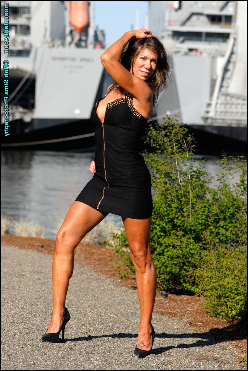 15P Bodybuilder Tammy Marie slips the straps of her dress over her bare shoulders