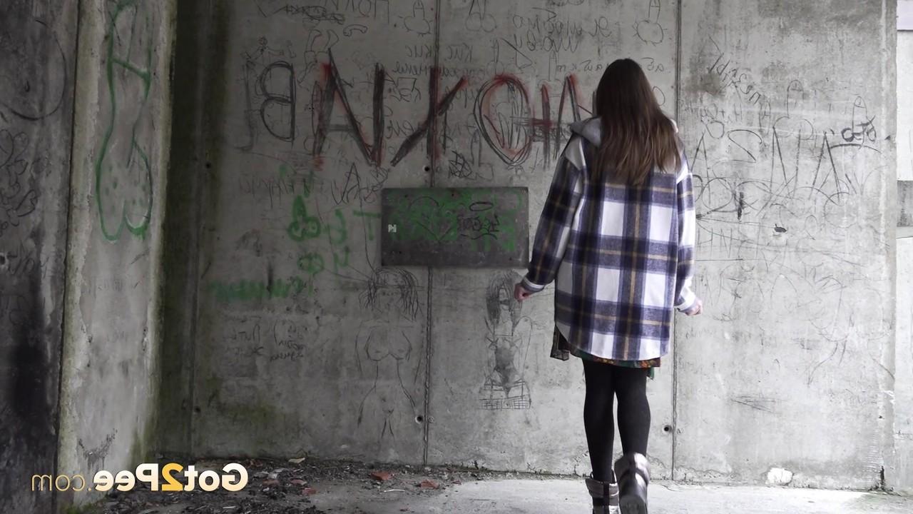 15P Caucasian girl Vika Lita pulls down her pantyhose to pee on a concrete pad