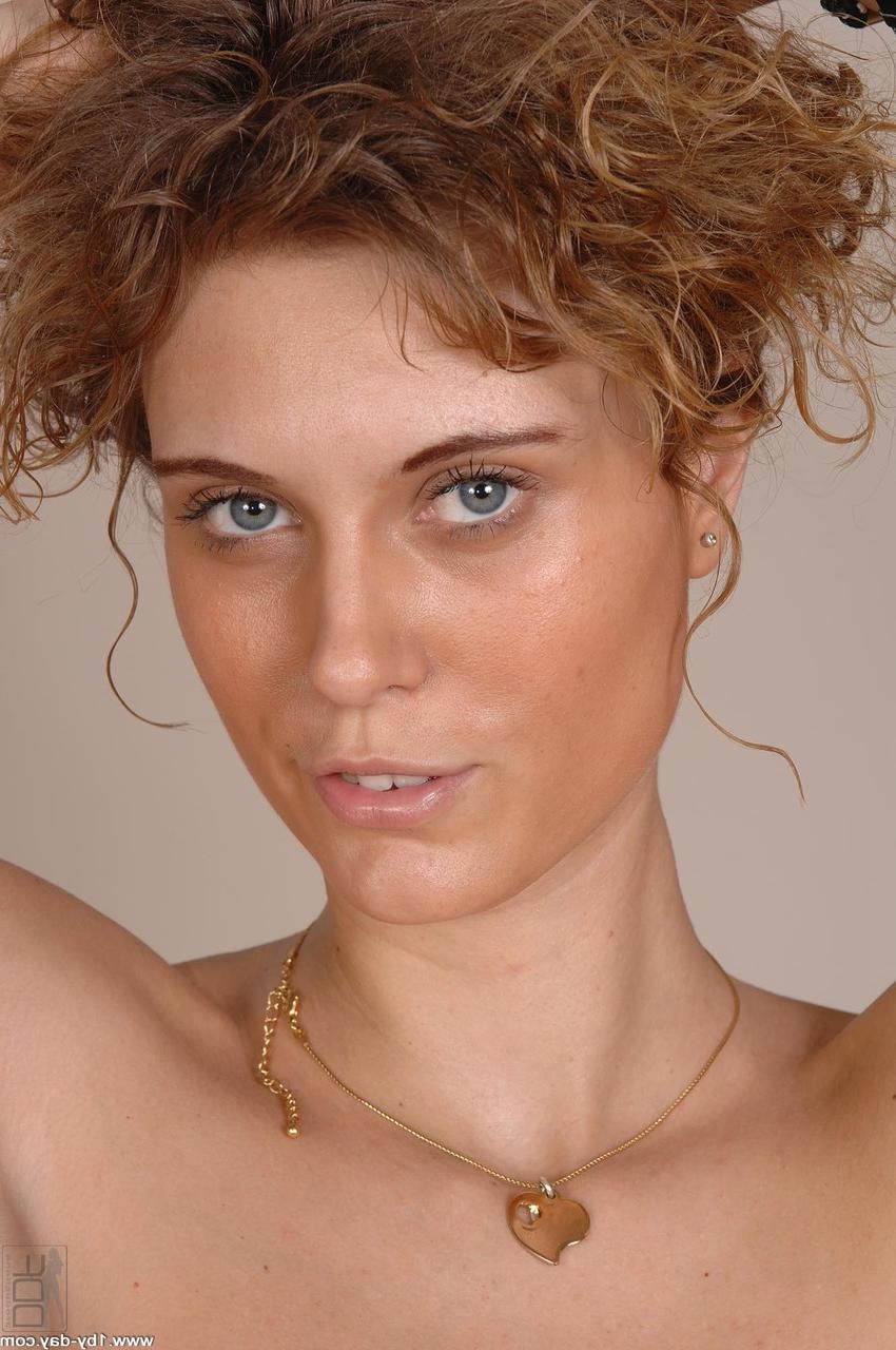 20P Curly haired slender babe Lilly showing off her juicy tits & puffy nipples