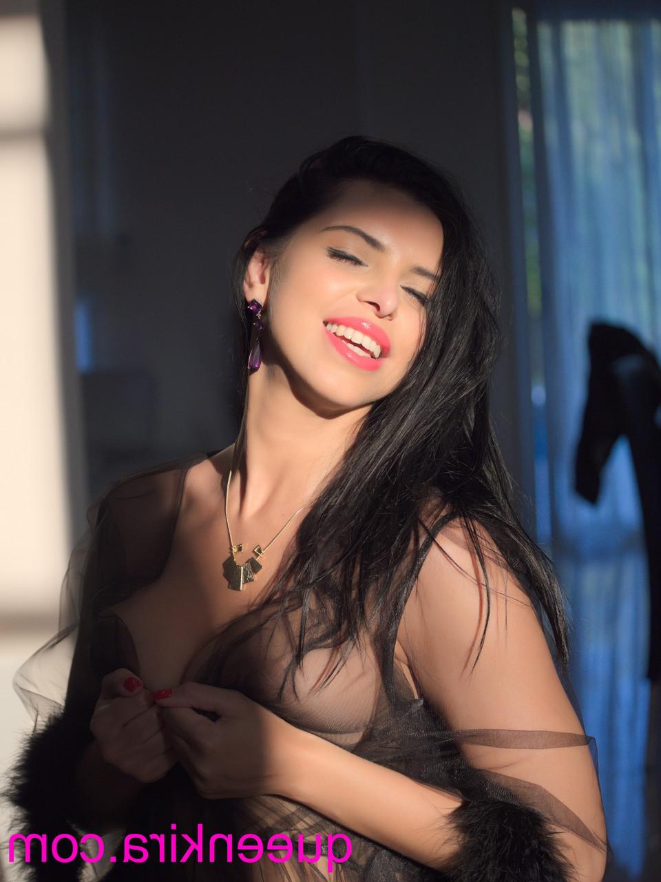 15P Hot Russian MILF Kira Queen flaunts her big tits while posing in a solo