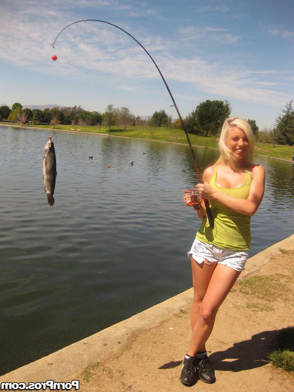 17P Buxom bombshell Britney Amber flaunts her naked big tits & butt while fishing