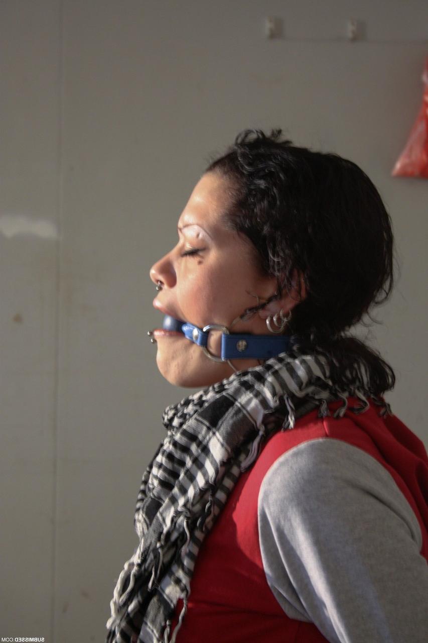 20P Clothed Czech MILF Steffi struggles while bound & ball-gagged in the garage