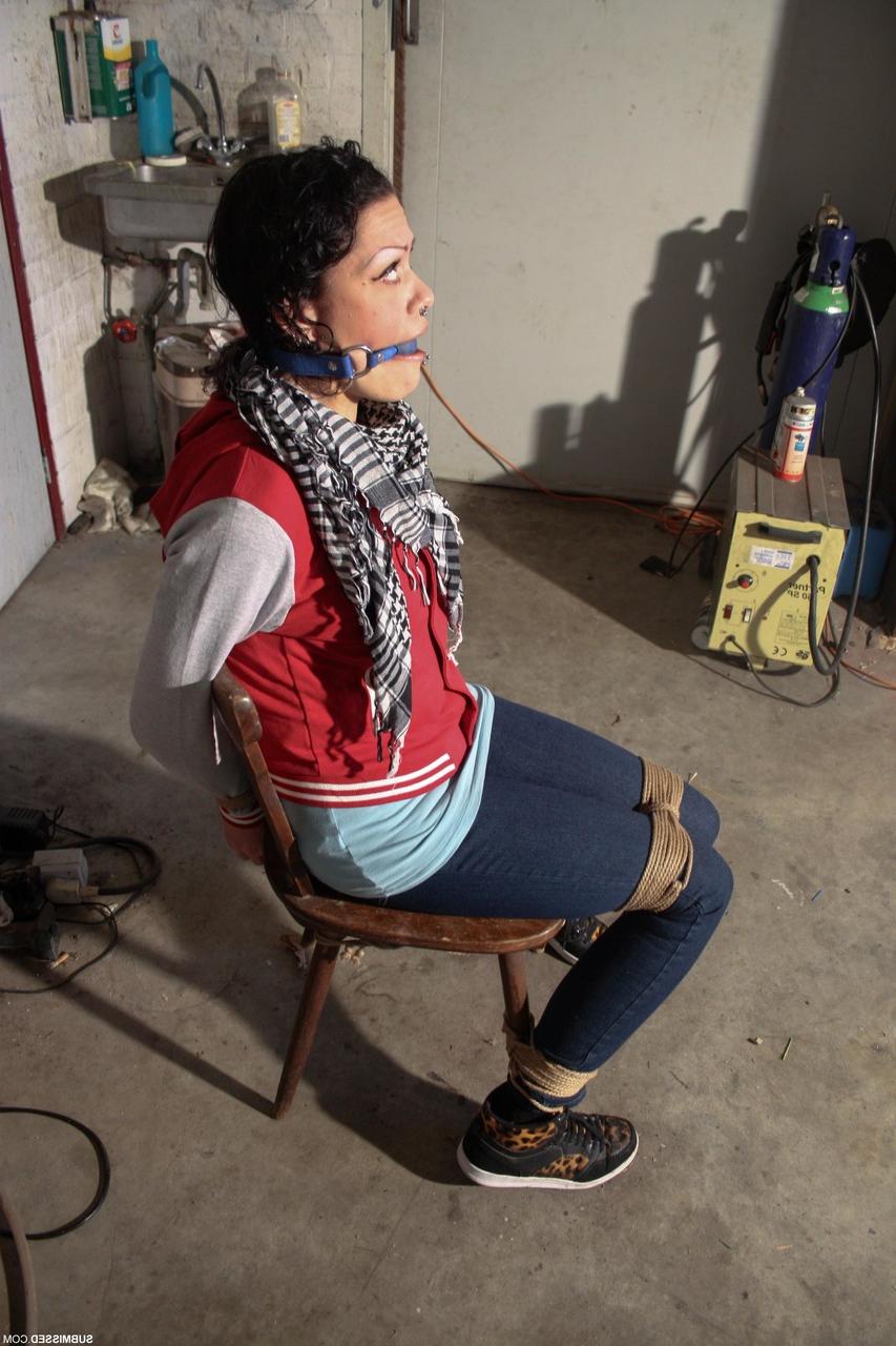 20P Clothed Czech MILF Steffi struggles while bound & ball-gagged in the garage