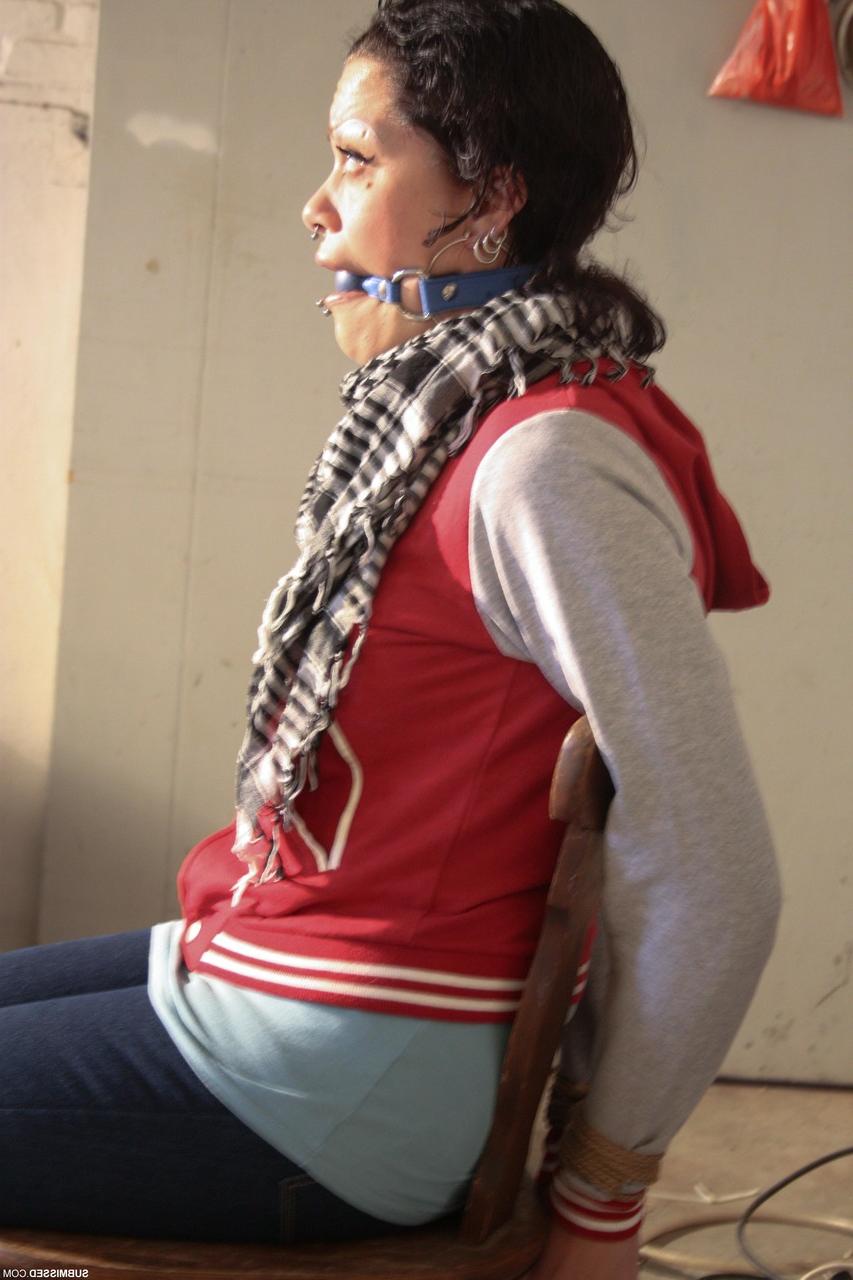 20P Clothed Czech MILF Steffi struggles while bound & ball-gagged in the garage