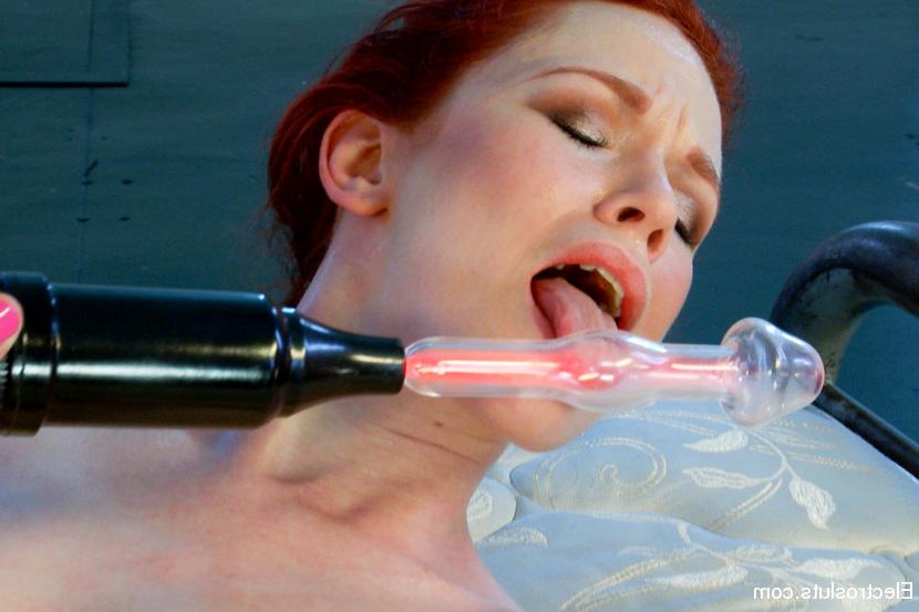 10P Redhead Justine Joli orgasms during lesbian electro play on a mattress