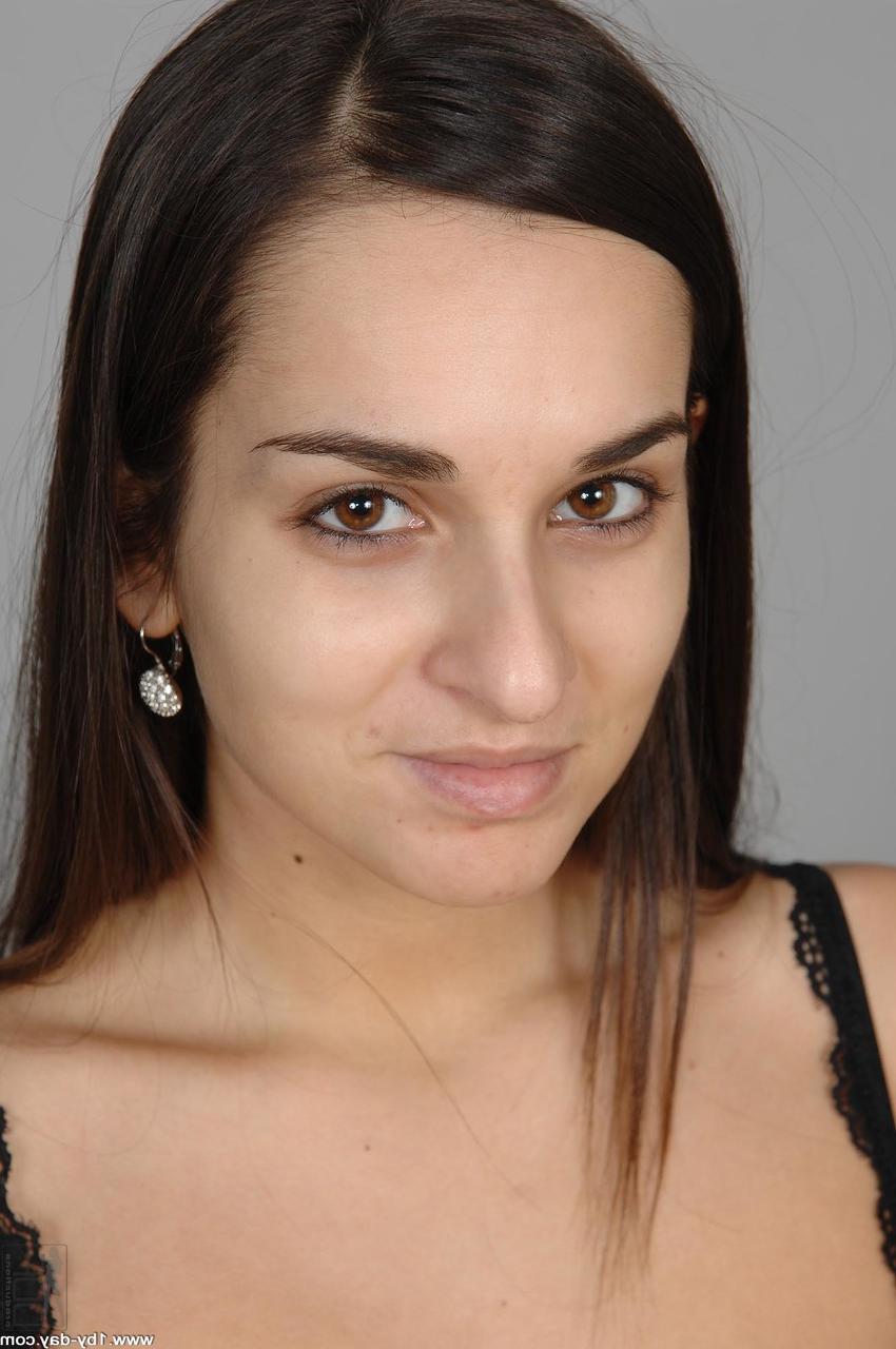 20P Brunette babe Ennie strips at the casting and shows her medium tits & big ass