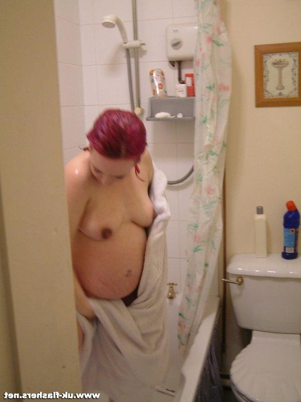 12P Pregnant redhead takes a shower while being secretly recorded on spy cam