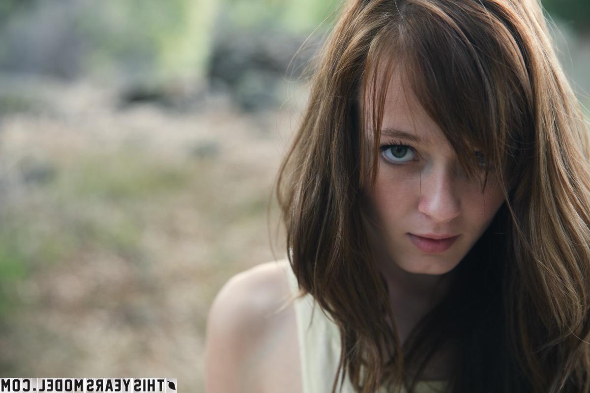 15P Young girl Ellie Jane pulls down her underwear on a blanket in a field
