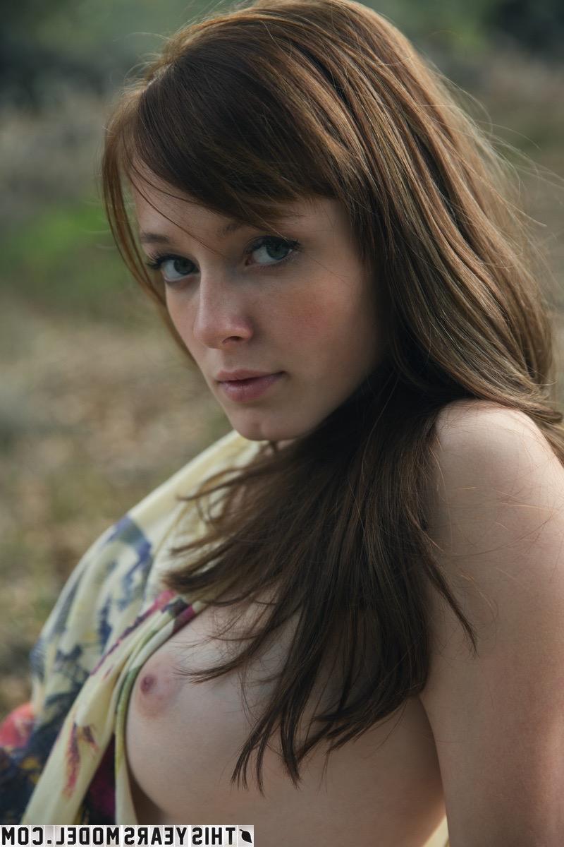 15P Young girl Ellie Jane pulls down her underwear on a blanket in a field