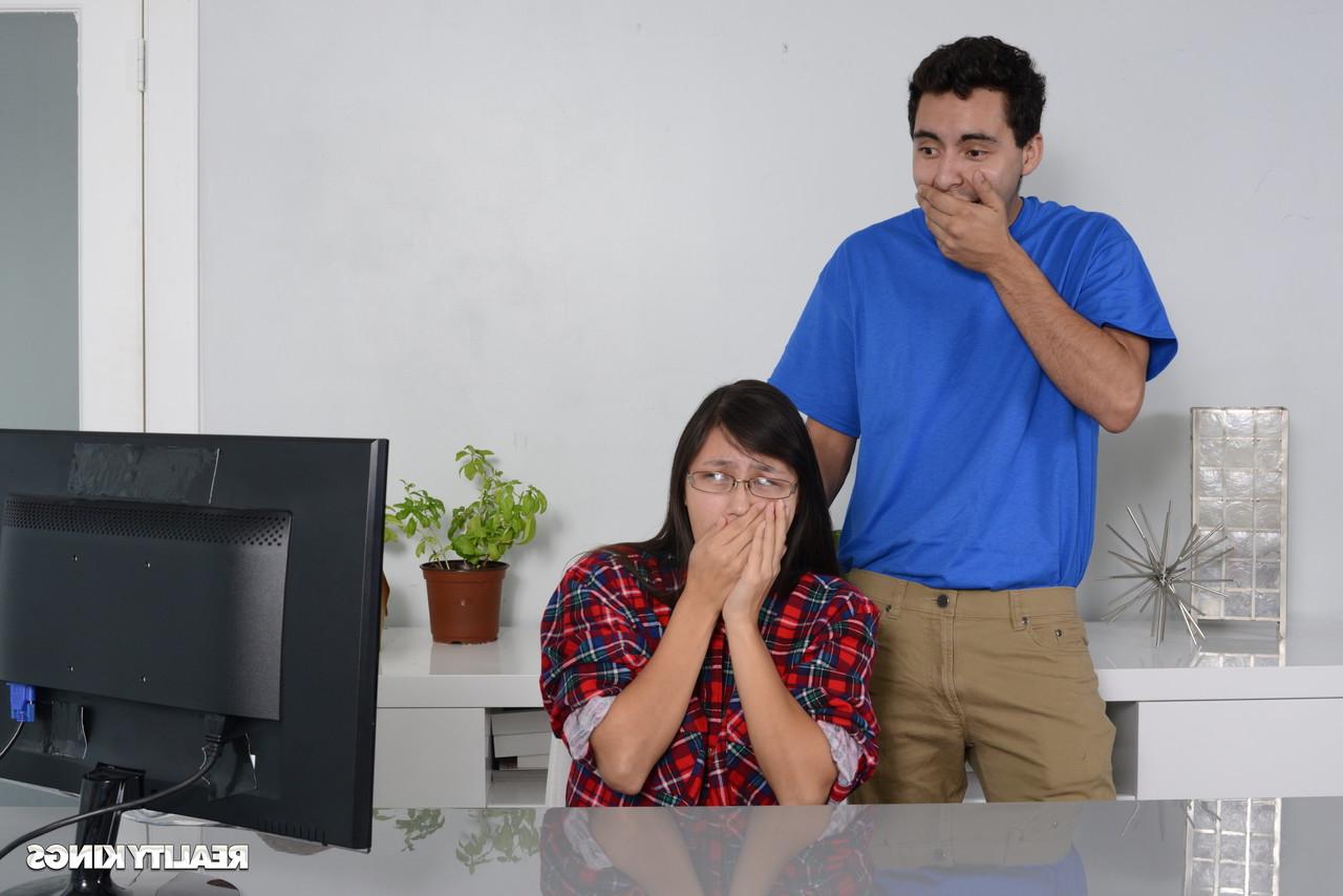 16P Petite Asian babe gets caught by her stepbrother watching porn on the PC