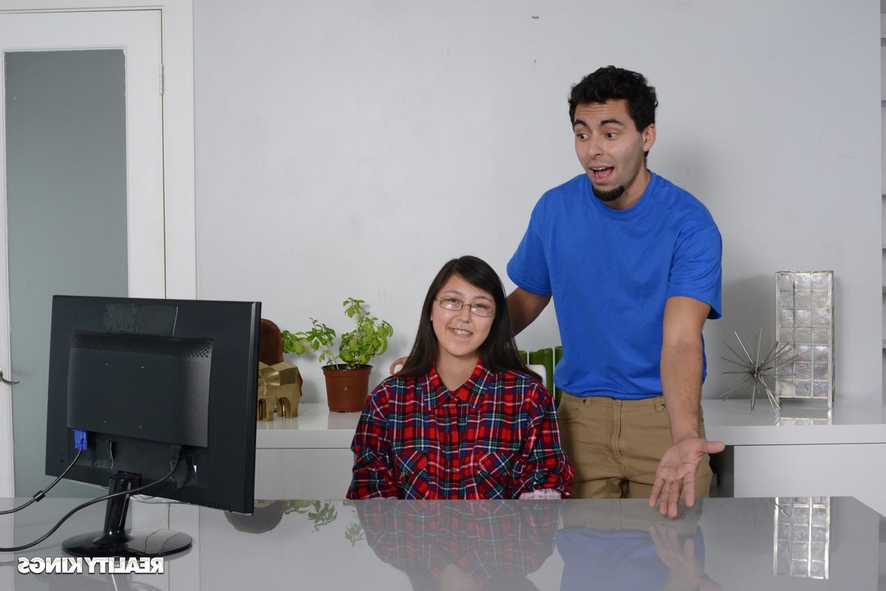 16P Petite Asian babe gets caught by her stepbrother watching porn on the PC