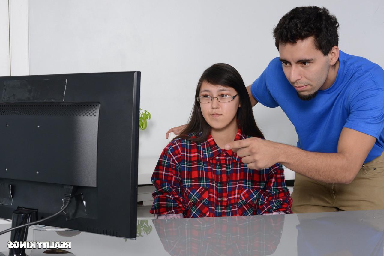 16P Petite Asian babe gets caught by her stepbrother watching porn on the PC