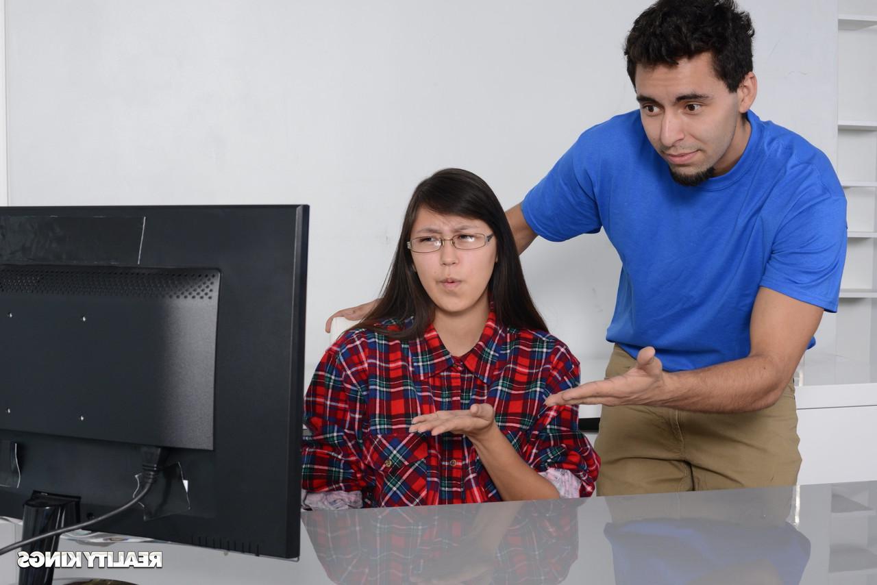 16P Petite Asian babe gets caught by her stepbrother watching porn on the PC