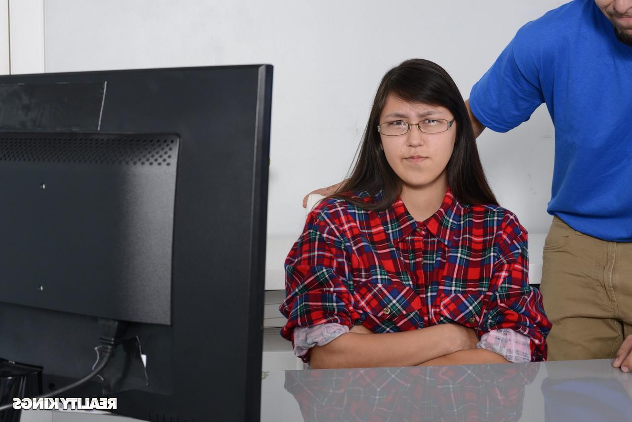 16P Petite Asian babe gets caught by her stepbrother watching porn on the PC