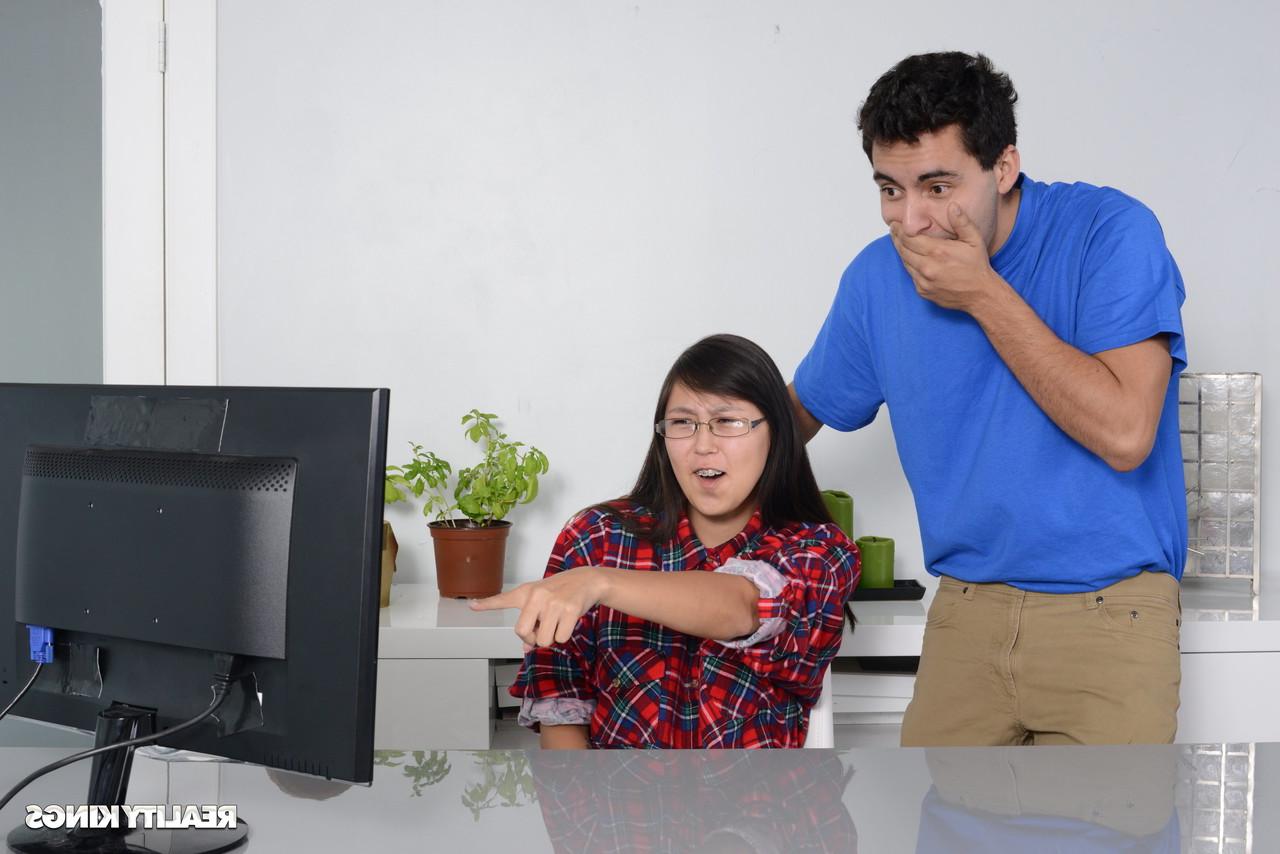 16P Petite Asian babe gets caught by her stepbrother watching porn on the PC